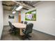 Modern meeting room with a large table and chairs at 1499 Blake St # 4O, Denver, CO 80202