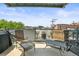 Private patio with seating and city views at 1499 Blake St # 4O, Denver, CO 80202