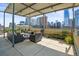 Relaxing rooftop terrace with city views and seating at 1499 Blake St # 4O, Denver, CO 80202