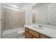 Classic bathroom with a bathtub, tiled walls, and vanity with storage space at 17156 W 92Nd Loop, Arvada, CO 80007