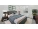 Stylish bedroom featuring contemporary décor, soft lighting, and a comfortable bed at 17156 W 92Nd Loop, Arvada, CO 80007