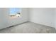 Bedroom with a window view, perfect for enjoying natural light and scenery at 17156 W 92Nd Loop, Arvada, CO 80007