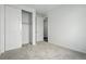 A light and airy bedroom featuring carpet and a closet at 17156 W 92Nd Loop, Arvada, CO 80007