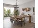 Modern dining room with wood flooring, large window, modern decor and elegant chairs at 17156 W 92Nd Loop, Arvada, CO 80007