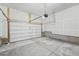 Clean, unfinished garage with concrete flooring and an automatic door; ready for your projects! at 17156 W 92Nd Loop, Arvada, CO 80007