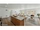 Bright, open floor plan connects the kitchen island to the dining and living areas at 17156 W 92Nd Loop, Arvada, CO 80007