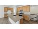 Bright kitchen featuring wood cabinets, stainless steel appliances, granite countertops and central island at 17156 W 92Nd Loop, Arvada, CO 80007