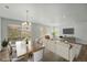 Beautifully staged living room with hardwood flooring and light neutral color palette at 17156 W 92Nd Loop, Arvada, CO 80007