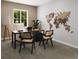 Modern office with sleek desk, two chairs and unique world map decor at 17156 W 92Nd Loop, Arvada, CO 80007
