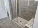 Walk-in shower features floor-to-ceiling tile and built-in bench seating at 17156 W 92Nd Loop, Arvada, CO 80007