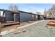 Stylish exterior with a covered porch, modern design, and low-maintenance landscaping; gravel with some natural stone at 5523 Tejon St, Denver, CO 80221