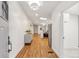 Bright entryway featuring hardwood floors and a skylight provides ample sunlight at 5523 Tejon St, Denver, CO 80221