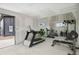 Spacious home gym featuring modern exercise equipment, large windows, and ample room for fitness activities at 5523 Tejon St, Denver, CO 80221