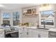 Open layout kitchen featuring quartz countertops and modern appliances at 5523 Tejon St, Denver, CO 80221