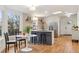 Charming kitchen with a central island, natural light, and stainless steel appliances at 5523 Tejon St, Denver, CO 80221