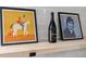 Kitchen shelf with a framed horse picture, a wine bottle, and a portrait at 5523 Tejon St, Denver, CO 80221