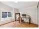 Well-lit office space featuring wood floors, large mirror, and desk with stylish decor at 5523 Tejon St, Denver, CO 80221