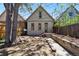 Home's backyard includes a stone seating area, wooden retaining wall and stairs up to the back entrance at 1529 E 22Nd Ave, Denver, CO 80205