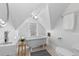 Bright bathroom with a standalone tub, modern sink, round mirror and natural light from a window at 1529 E 22Nd Ave, Denver, CO 80205