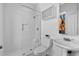All white bathroom featuring a tiled shower and vintage style sink at 1529 E 22Nd Ave, Denver, CO 80205