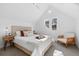 Cozy bedroom featuring neutral décor, a plush bed, and bright natural light at 1529 E 22Nd Ave, Denver, CO 80205