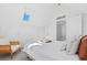 Bright bedroom featuring all white decor, and a skylight at 1529 E 22Nd Ave, Denver, CO 80205