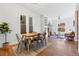 Open concept living and dining room with a fireplace, ceiling fan, and plenty of natural light at 1529 E 22Nd Ave, Denver, CO 80205