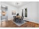 Sunlit dining room with a metal table set, hardwood floors, and ample natural light at 1529 E 22Nd Ave, Denver, CO 80205
