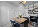 This kitchen has an island with seating and decorative tin ceilings at 1529 E 22Nd Ave, Denver, CO 80205