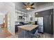 Newly renovated kitchen boasts stainless steel appliances, floating shelves, and a center island at 1529 E 22Nd Ave, Denver, CO 80205