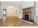 Spacious living area with fireplace and hardwood flooring for a cozy ambiance at 1529 E 22Nd Ave, Denver, CO 80205