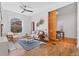 Sunlit living space with hardwood floors, comfortable seating, and stylish decor at 1529 E 22Nd Ave, Denver, CO 80205