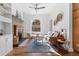 Bright, well-lit living room featuring a brick fireplace and hardwood floors at 1529 E 22Nd Ave, Denver, CO 80205