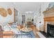 Open-concept living space with hardwood floors, built-ins, and a fireplace at 1529 E 22Nd Ave, Denver, CO 80205