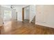 Bright living room features hardwood floors, a ceiling fan, and original features at 1529 E 22Nd Ave, Denver, CO 80205