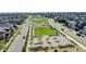 Community aerial view showcasing landscaped streets, green spaces, and modern homes at 7932 E 49Th Pl, Denver, CO 80238
