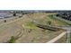 Aerial view of park with walking trails, landscaping, and a unique sculpture at 7932 E 49Th Pl, Denver, CO 80238