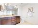Bathroom features a double vanity, granite countertops, and a glass-enclosed shower at 7932 E 49Th Pl, Denver, CO 80238