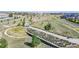 Neighborhood park with walking trails and public art installation at 7932 E 49Th Pl, Denver, CO 80238