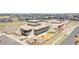 View of the school building in a residential community with playground and athletic field at 7932 E 49Th Pl, Denver, CO 80238