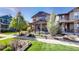 Inviting home with landscaped front yard and cozy covered front porch at 7932 E 49Th Pl, Denver, CO 80238