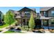 Charming two-story home with a landscaped front yard and inviting porch at 7932 E 49Th Pl, Denver, CO 80238