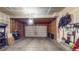 A clean and organized two-car garage with ample storage and a well-maintained garage door at 7932 E 49Th Pl, Denver, CO 80238
