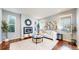 Cozy living room with a modern fireplace and ample seating at 7932 E 49Th Pl, Denver, CO 80238
