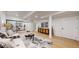 Open living room features stylish furniture, wood floors, and contemporary design at 7932 E 49Th Pl, Denver, CO 80238
