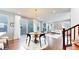 Open floor plan with dining area and a connected, cozy living room at 7932 E 49Th Pl, Denver, CO 80238
