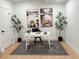 Home office space with a modern desk and decorative artwork at 7932 E 49Th Pl, Denver, CO 80238
