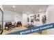 Bright home office featuring hardwood floors, modern decor, a white desk, and attractive art at 7932 E 49Th Pl, Denver, CO 80238