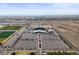 Aerial view of a modern stadium with large parking lot in an expansive cityscape at 7932 E 49Th Pl, Denver, CO 80238
