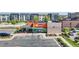 Modern fast-food restaurant with a patio and adjacent parking area in a neighborhood at 7932 E 49Th Pl, Denver, CO 80238